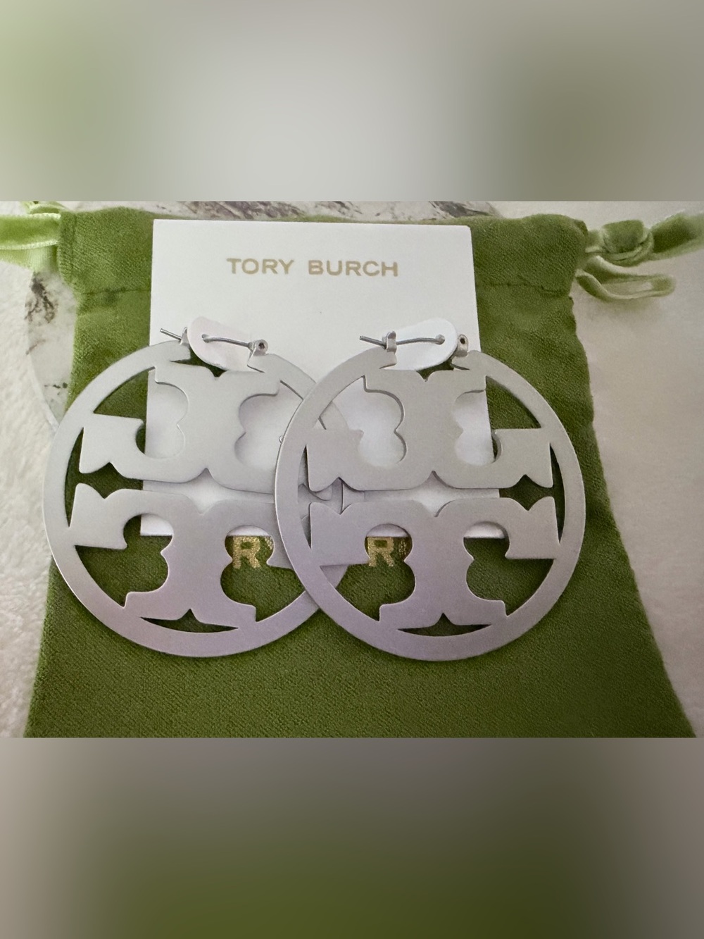 Tory Burch Matte Silver Large Round Logo Earrings hinged closure